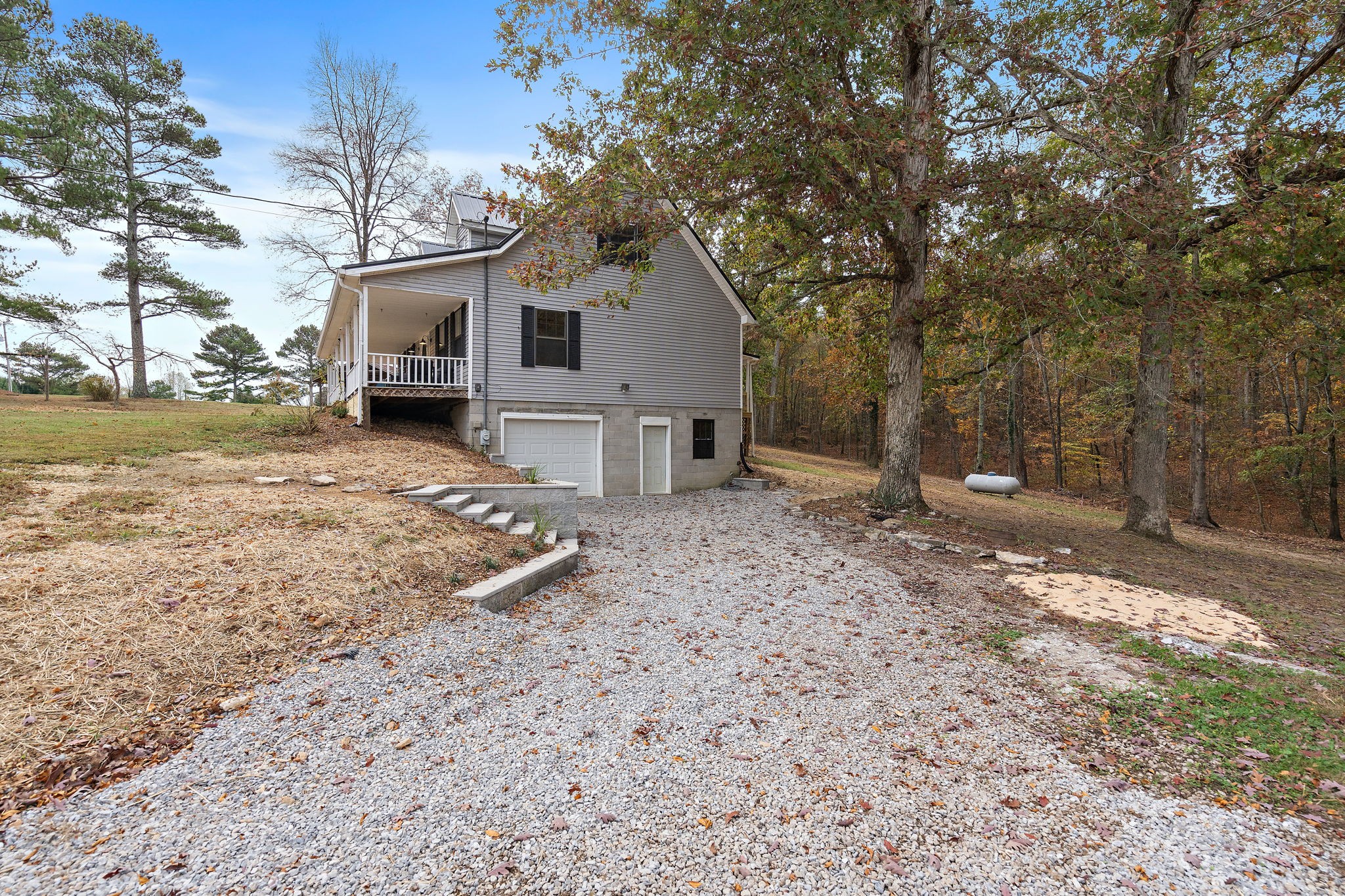 131 Locker Road Summertown, TN 38483 - Photo 31 of 38 a view of a house with a yard covered in snow