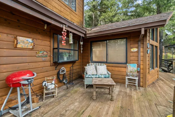 a view of a house that has a tree in it
