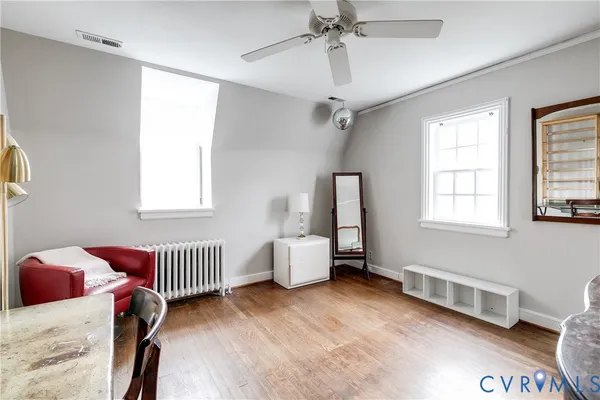 a bedroom with furniture and windows