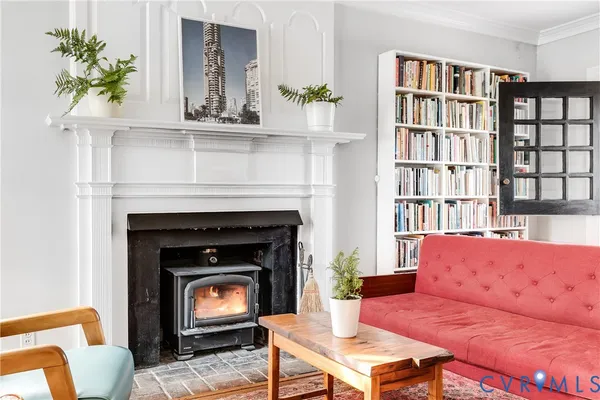 a living room with furniture and a fireplace