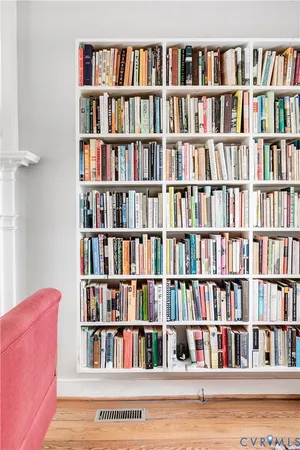 a book room with furniture and a book shelf