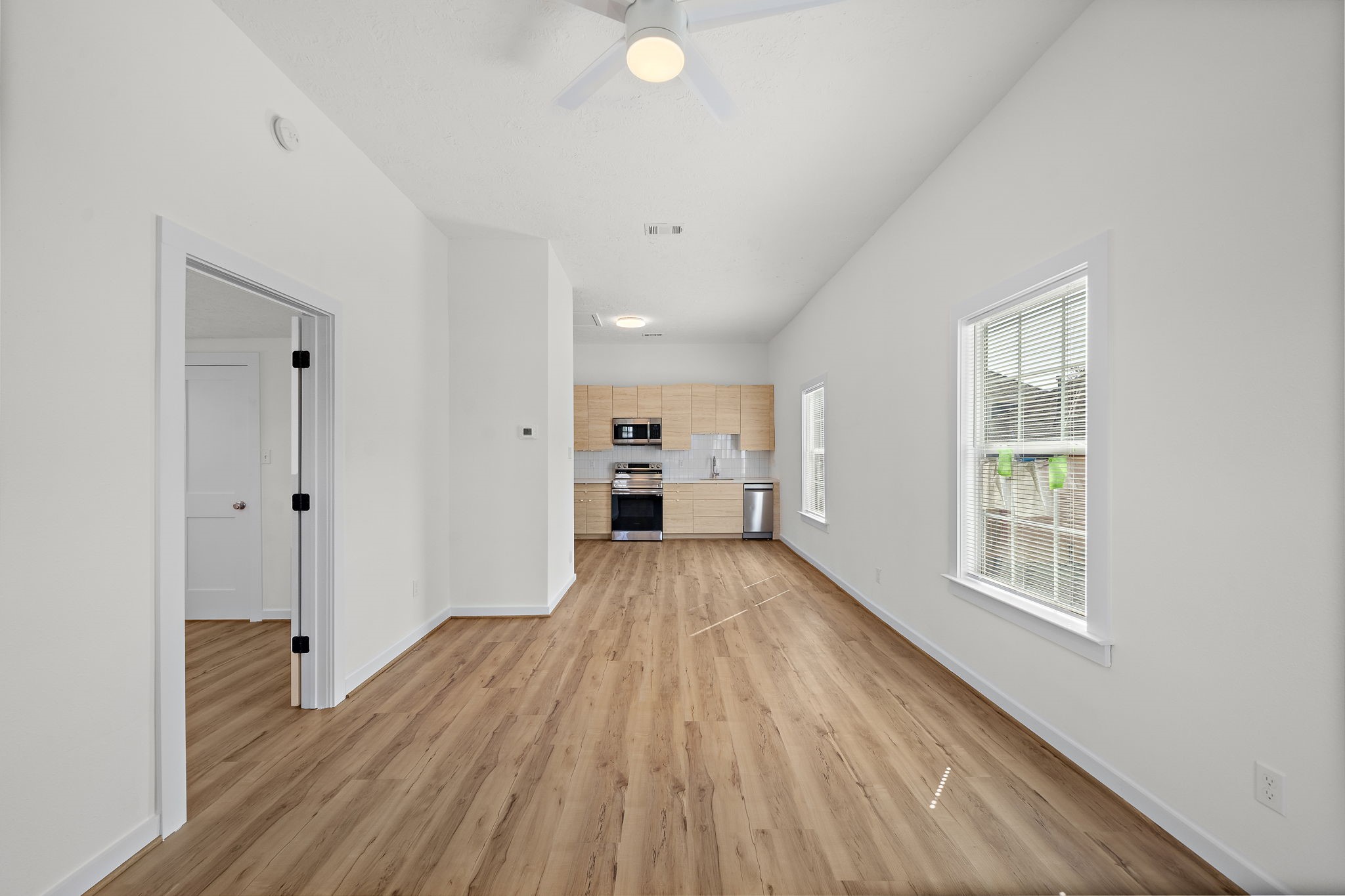 Step through the front door into the open plan Living-Kitchen area. There is also room for a small dining table or a desk / office