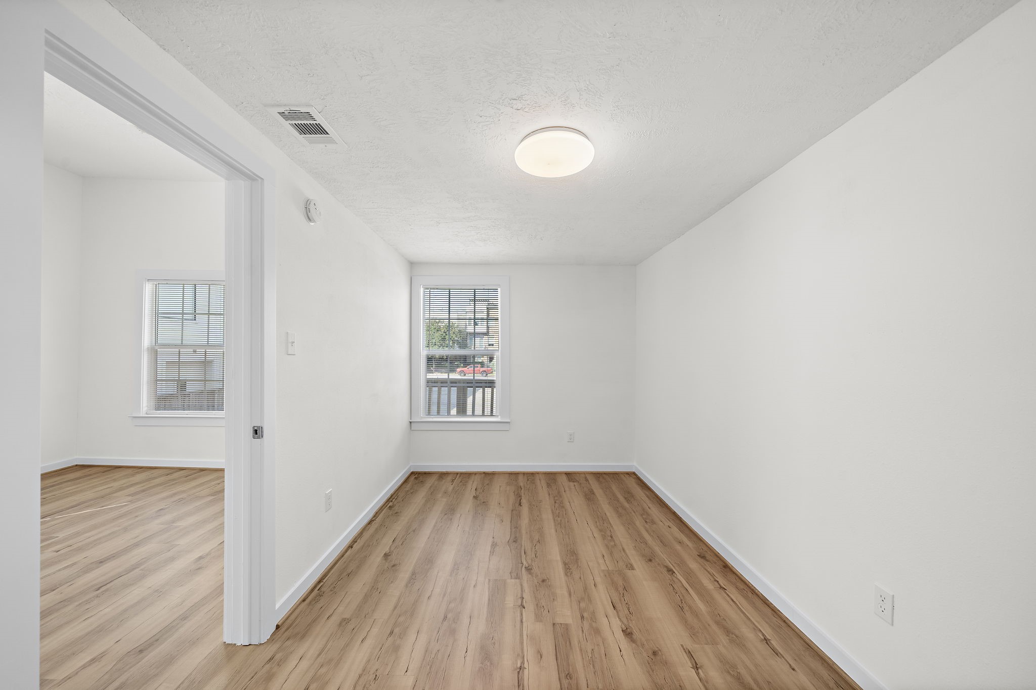 1414 Shearn Street, Unit B Houston, TX 77007 - Photo 6 of 10 Bedroom with window for natural light! Engineered flooring throughout. Previous tenant had a KING bed in here