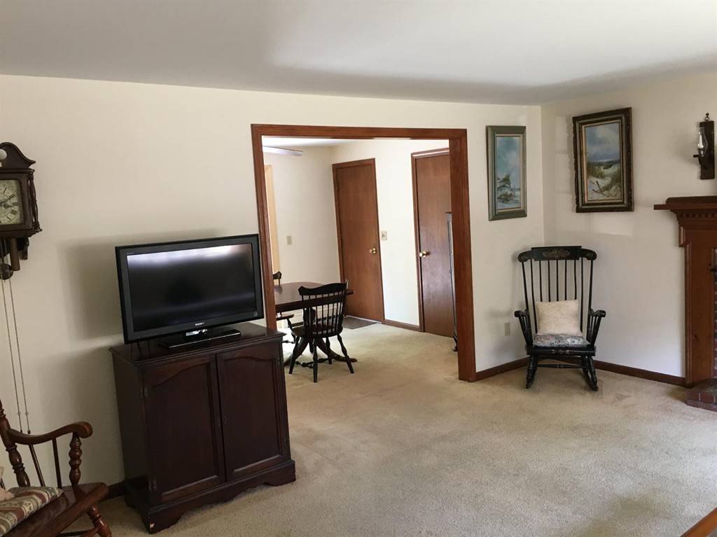 69 Stub Toe Road Barnstable, MA 02635 - Photo 13 of 27 a living room with furniture and a flat screen tv