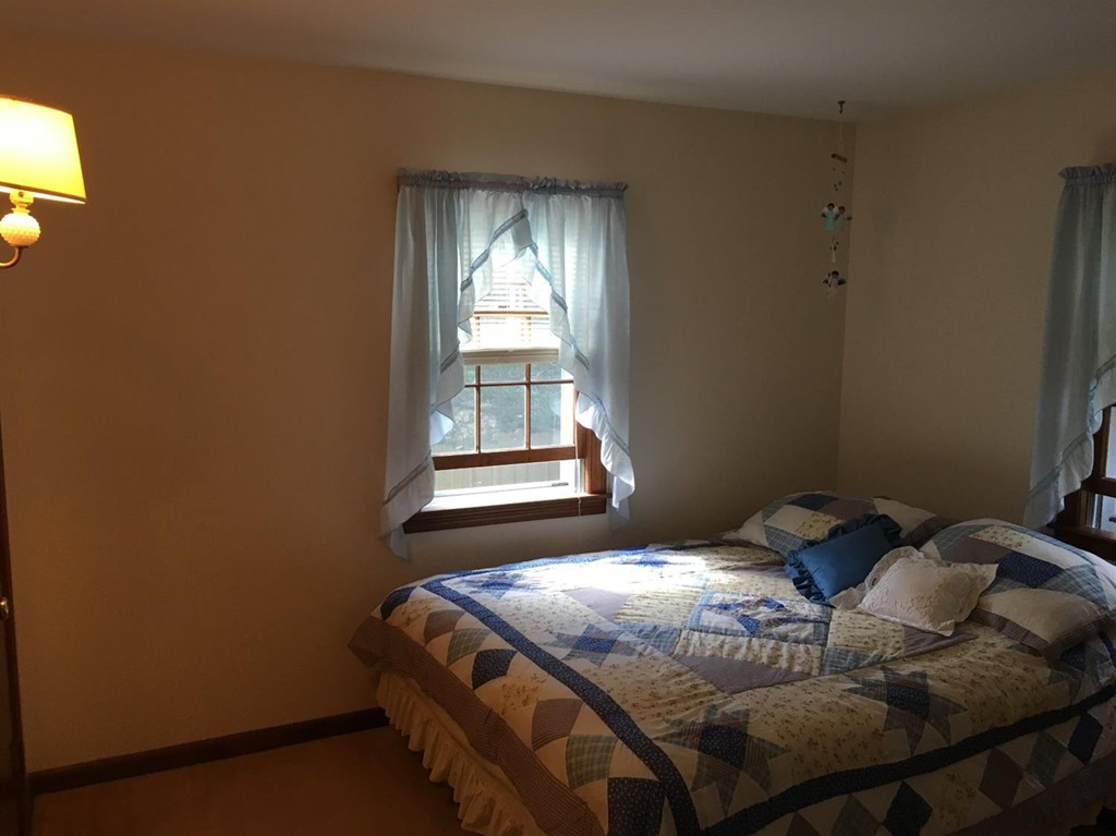 69 Stub Toe Road Barnstable, MA 02635 - Photo 17 of 27 a bedroom with a bed and a window