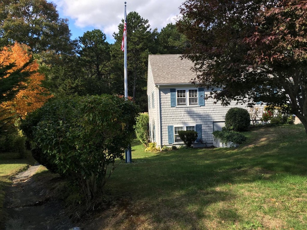 69 Stub Toe Road Barnstable, MA 02635 - Photo 2 of 27 a front view of a house with garden