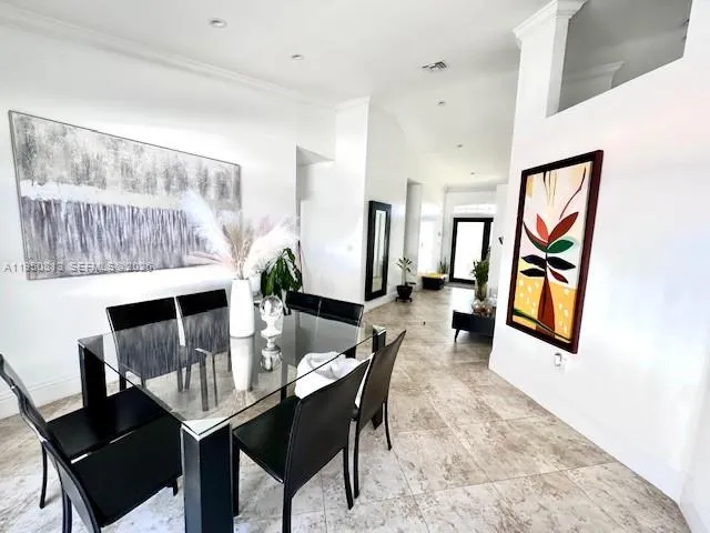 a dining room with furniture and window