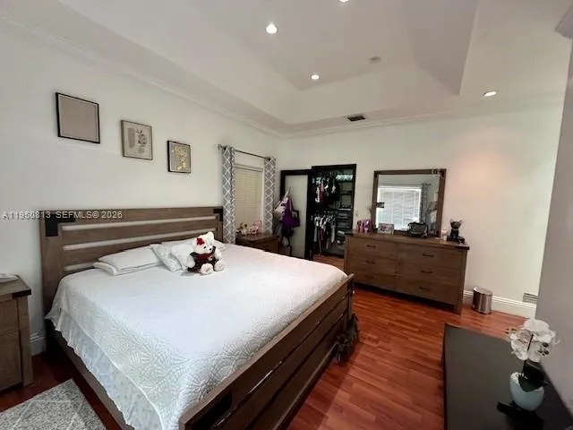 a large white bed in a white room