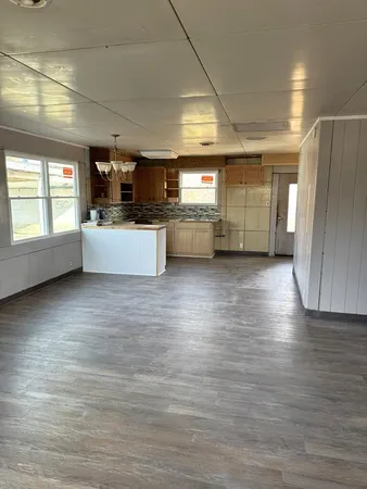 a kitchen with stainless steel appliances a refrigerator and a stove top oven