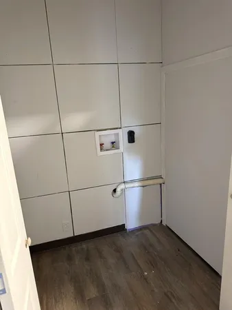 a bathroom with a sink a toilet a window and bathtub