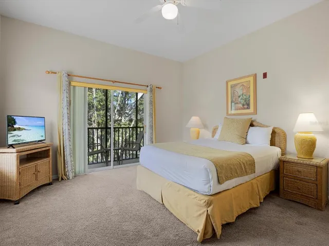 a spacious bedroom with a bed and a couch