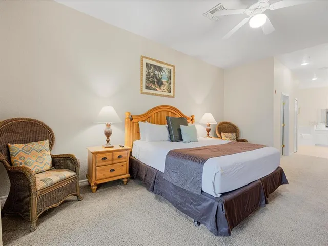 a bedroom with bed and window