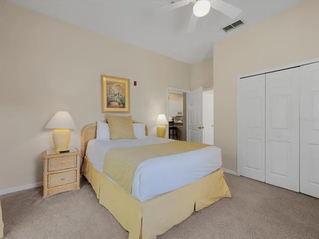 a spacious bedroom with two beds and a window