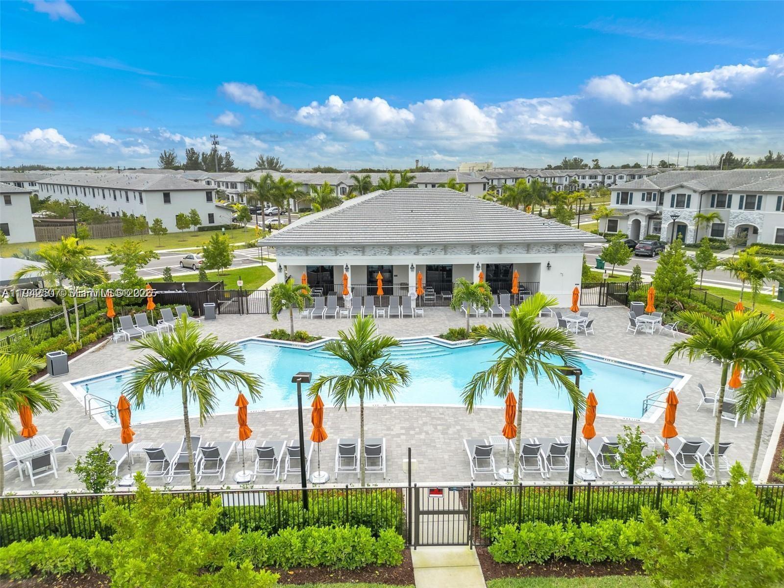 a front view of multiple houses with yard
