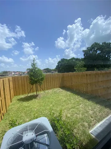 a view of a garden with an outdoor space
