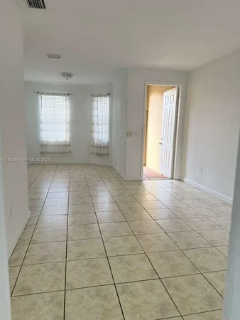 a view of an empty room and window