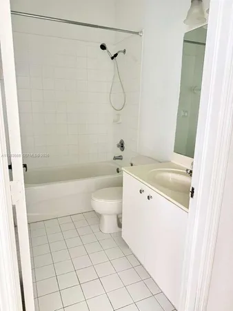 a bathroom with a toilet a sink and a shower