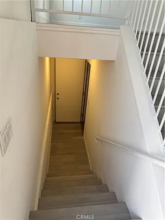 a view of a hallway with staircase