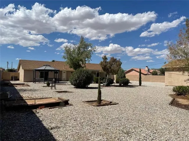 a view of a street with a building in the background
