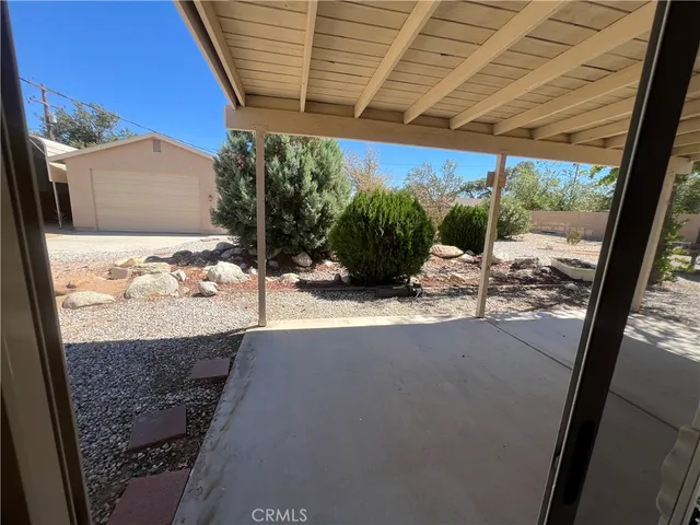 a view of a backyard of the house