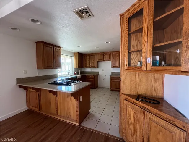 a kitchen with a stove and a refrigerator