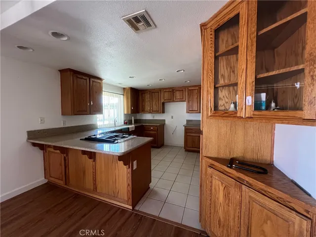a kitchen with a stove and a refrigerator
