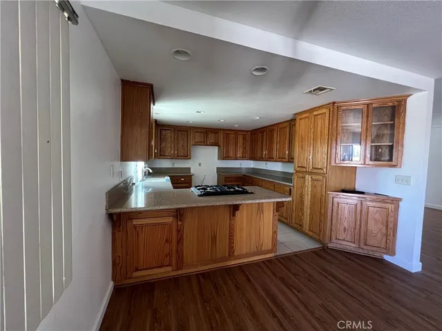 a kitchen with stainless steel appliances granite countertop a stove and a sink