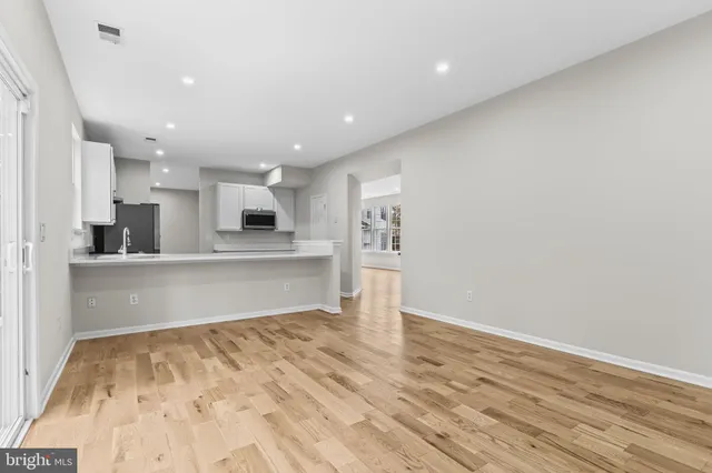 a view of kitchen with wooden floor