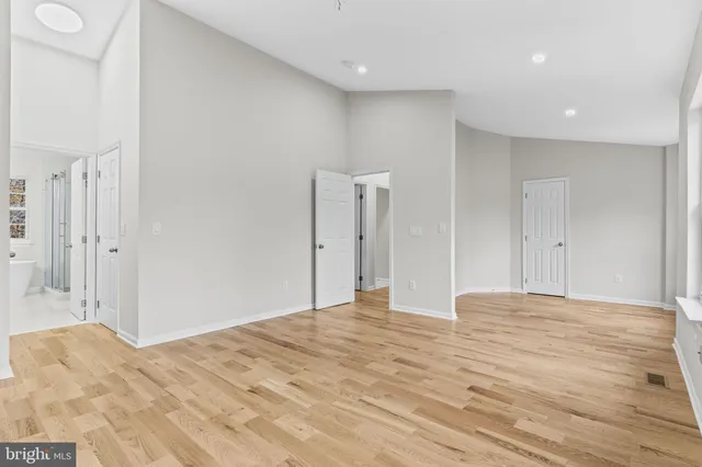 a bathroom with a sink double vanity granite tub shower and a mirror