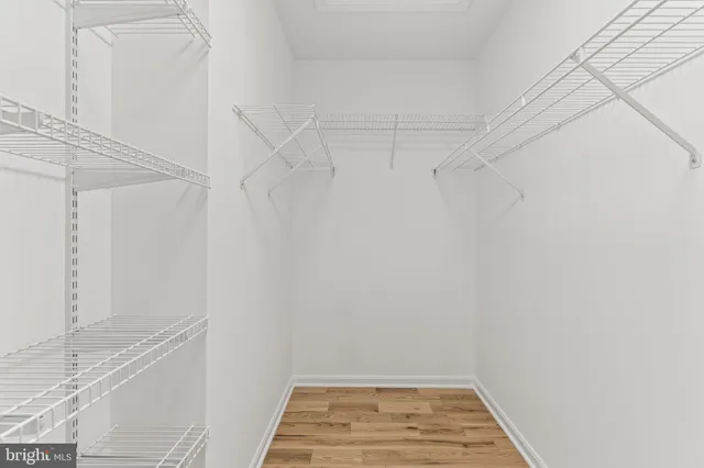 a white bath tub sitting next to a shower