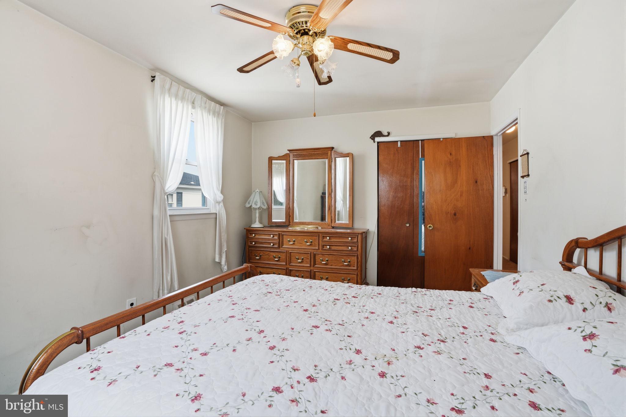 3622 Chesterfield Road Philadelphia, PA 19114 - Photo 11 of 23 a bedroom with a bed and wooden floor