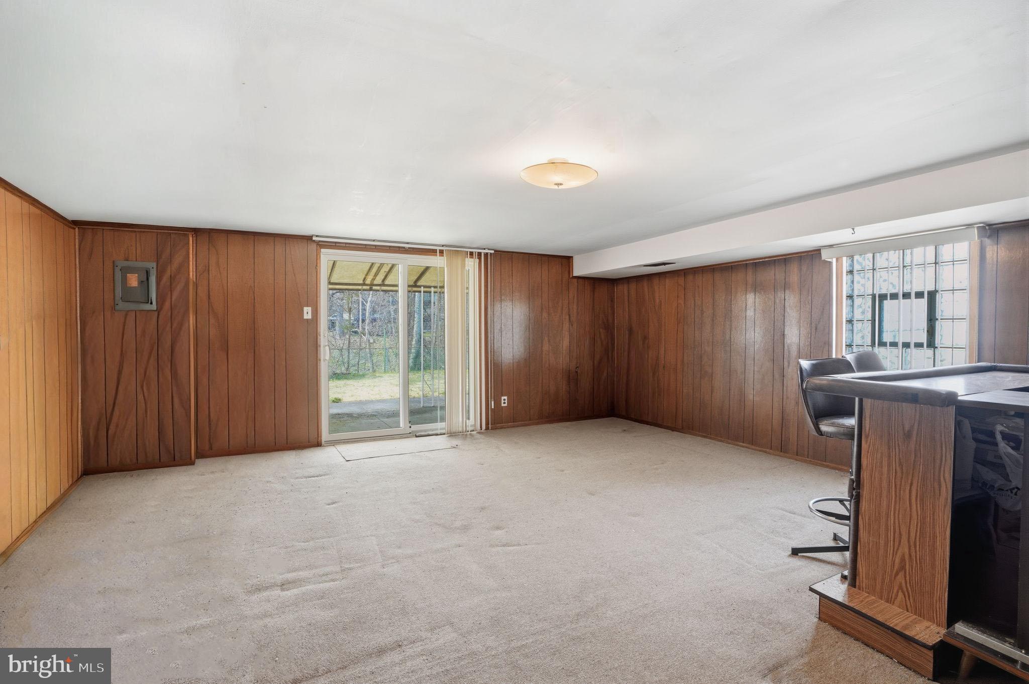 3622 Chesterfield Road Philadelphia, PA 19114 - Photo 16 of 23 an empty room with a fireplace and windows