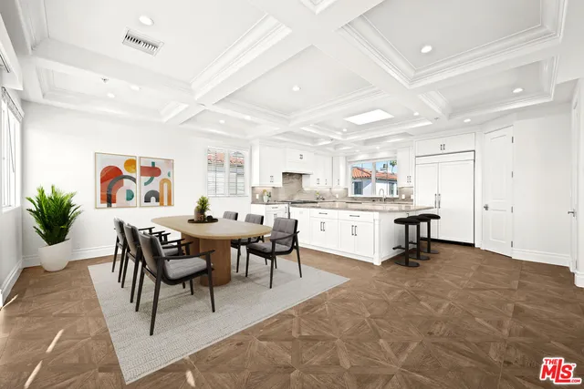 a kitchen with stainless steel appliances and cabinets