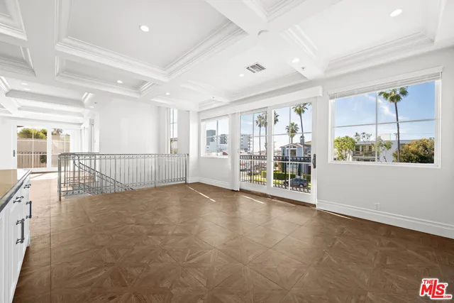 a bathroom with a granite countertop toilet sink and mirror