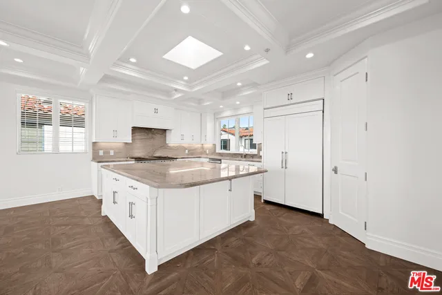 a view of staircase with railing and a chandelier