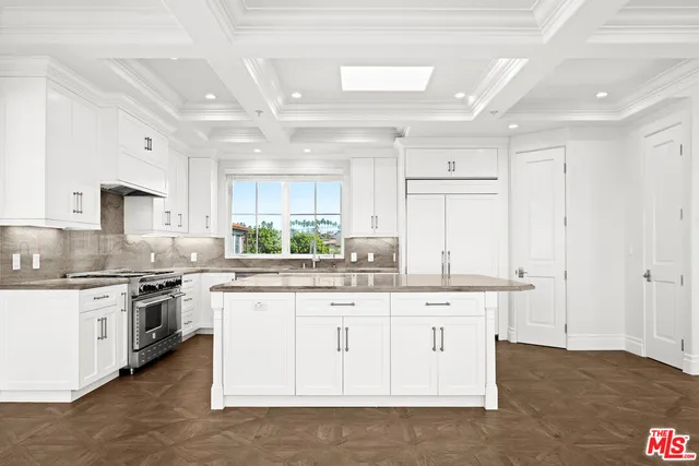 a bathroom with a granite countertop tub double vanity sink and a large mirror