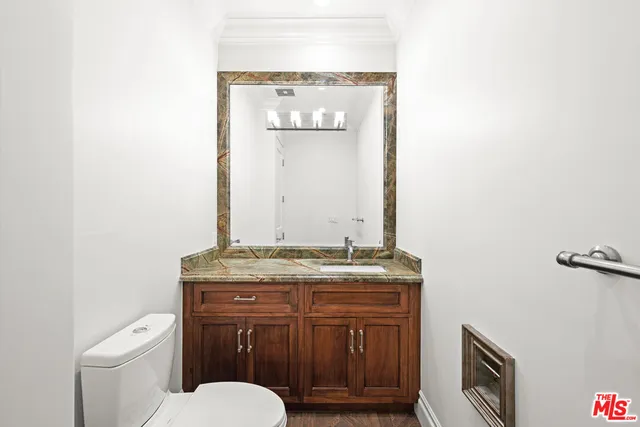 an empty room with a window and ceiling fan