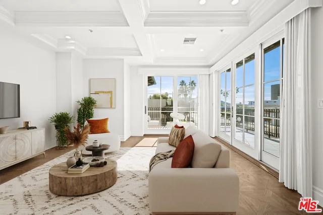 a view of a dining room kitchen with furniture and a potted plant