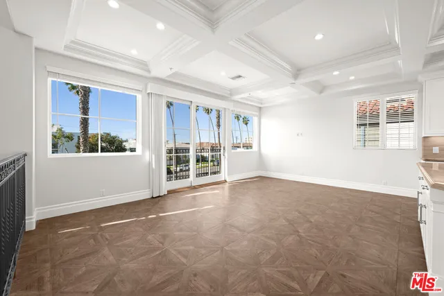 a kitchen with kitchen island a sink stove top oven and cabinets