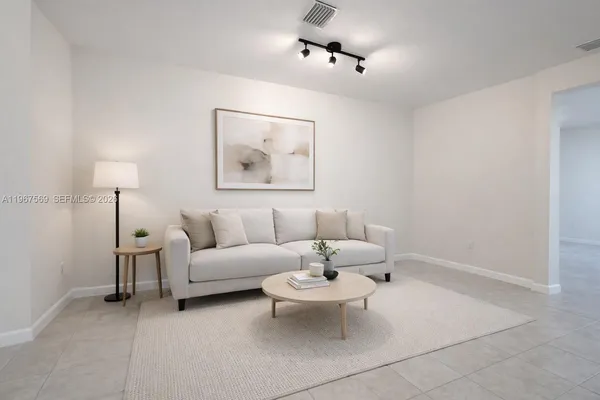 a living room with furniture and a table