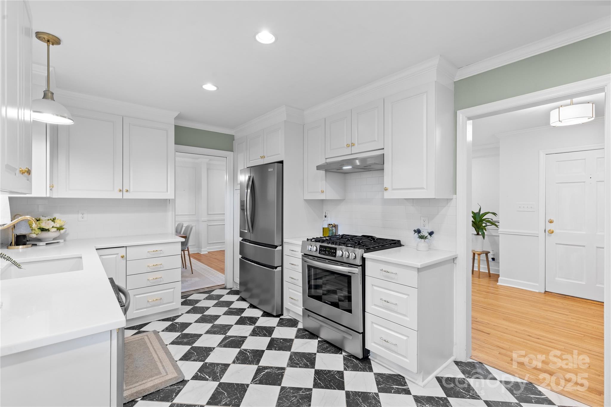 1024 Regency Drive Charlotte, NC 28211 - Photo 16 of 47 a kitchen with granite countertop appliances a sink and a counter space
