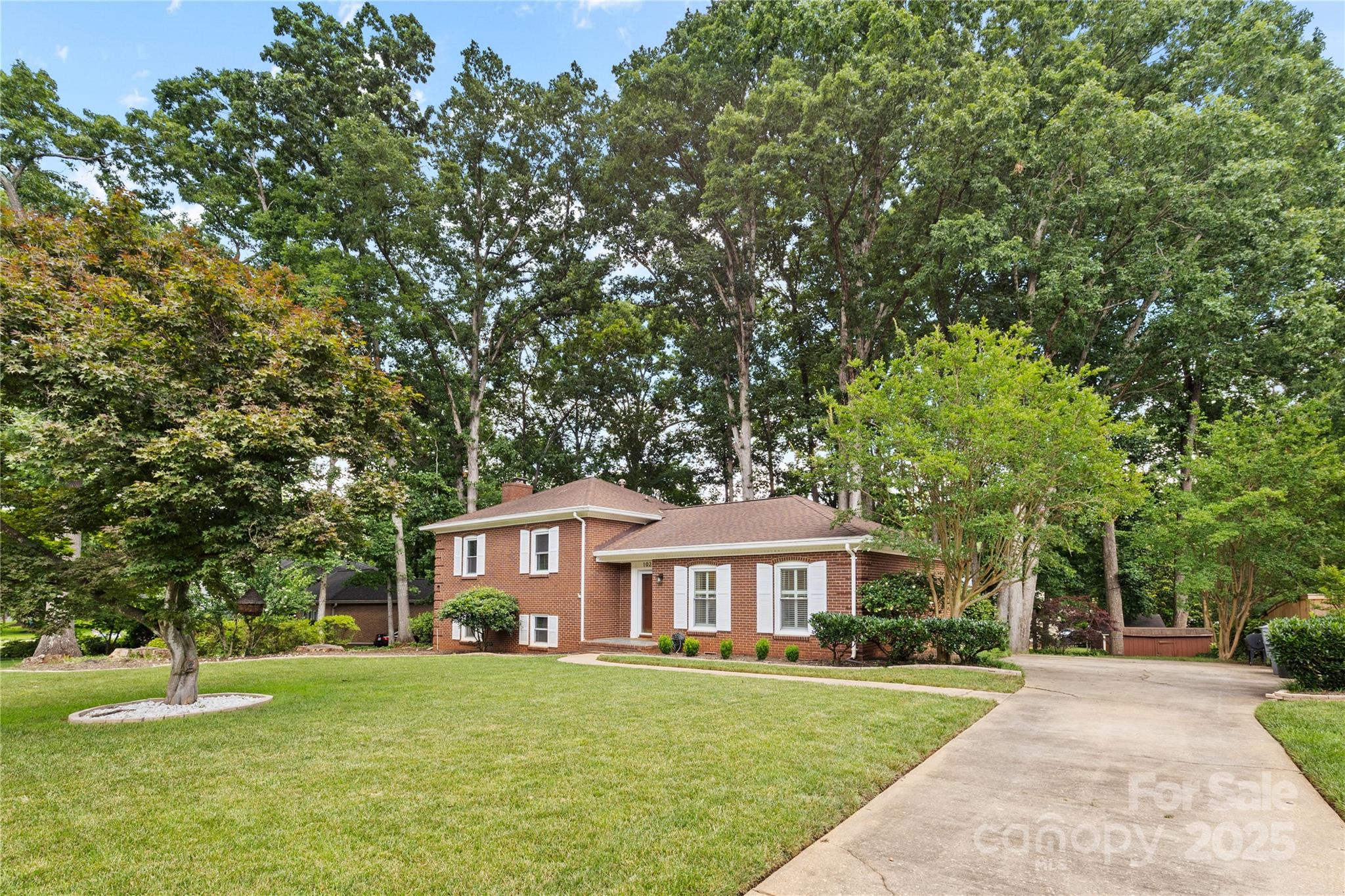 1024 Regency Drive Charlotte, NC 28211 - Photo 2 of 47 a front view of a house with a garden