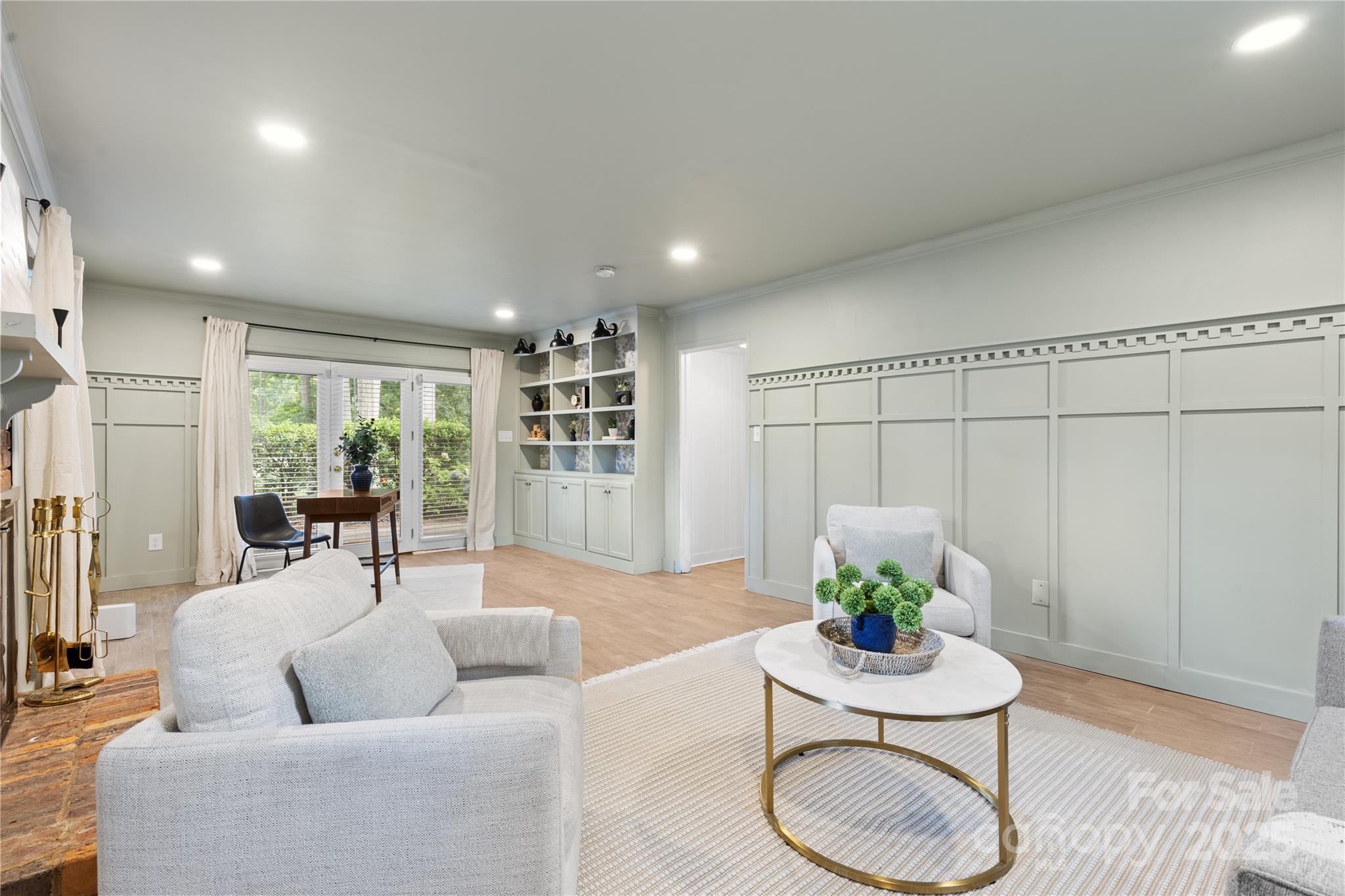 1024 Regency Drive Charlotte, NC 28211 - Photo 33 of 47 a living room with furniture and a wooden floor