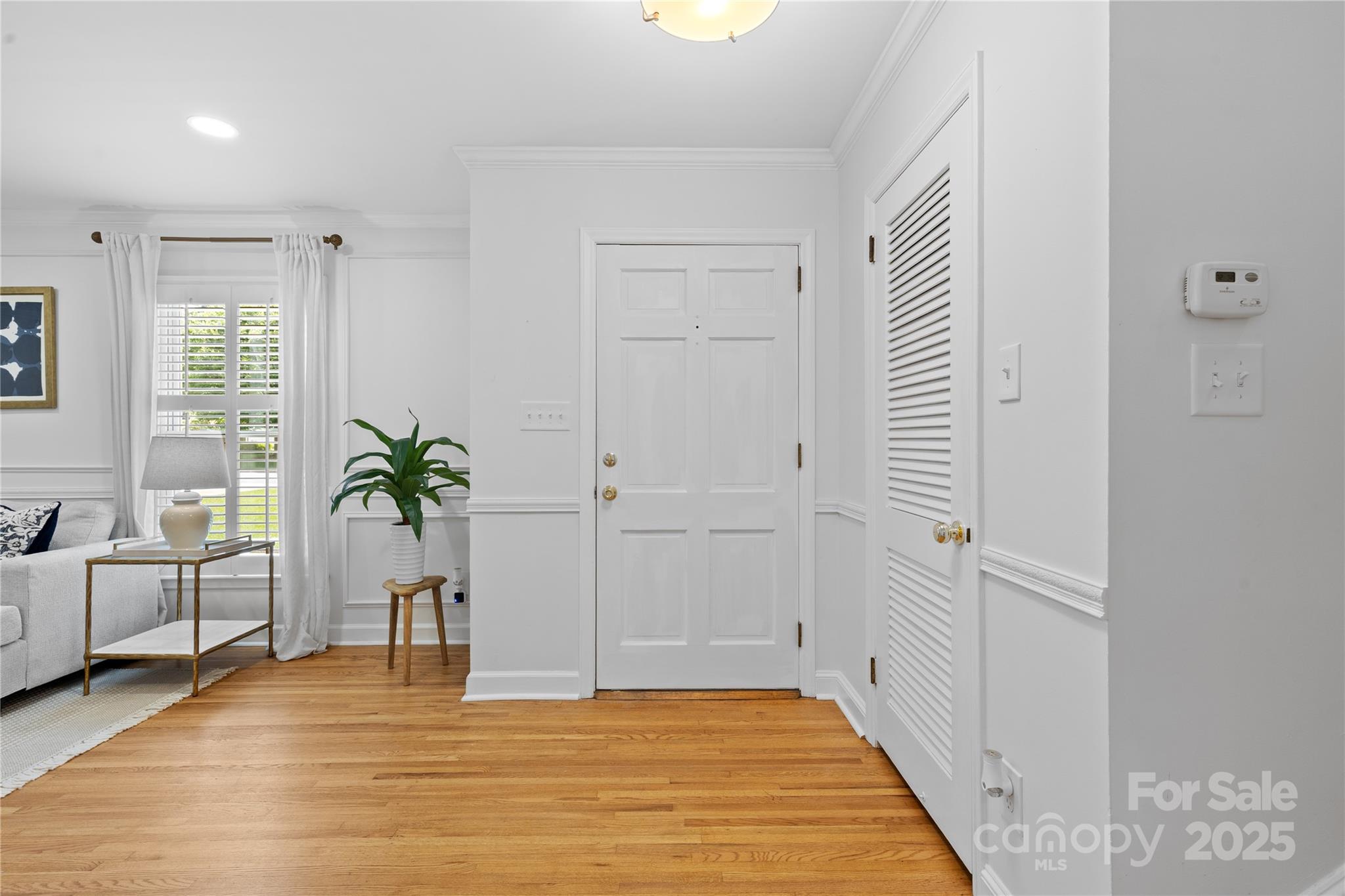 1024 Regency Drive Charlotte, NC 28211 - Photo 6 of 47 a view of a livingroom with a potted plant