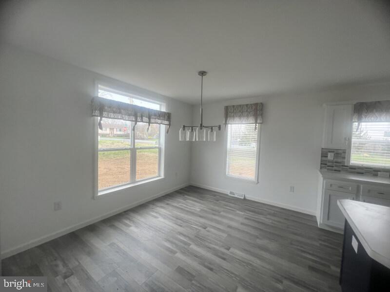 71 Ash Road Hamburg, PA 19526 - Photo 14 of 21 an empty room with wooden floor and windows