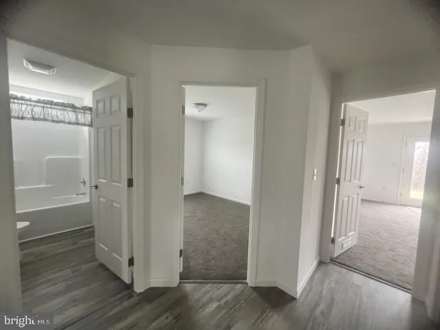 a view of a bathroom with wooden floor