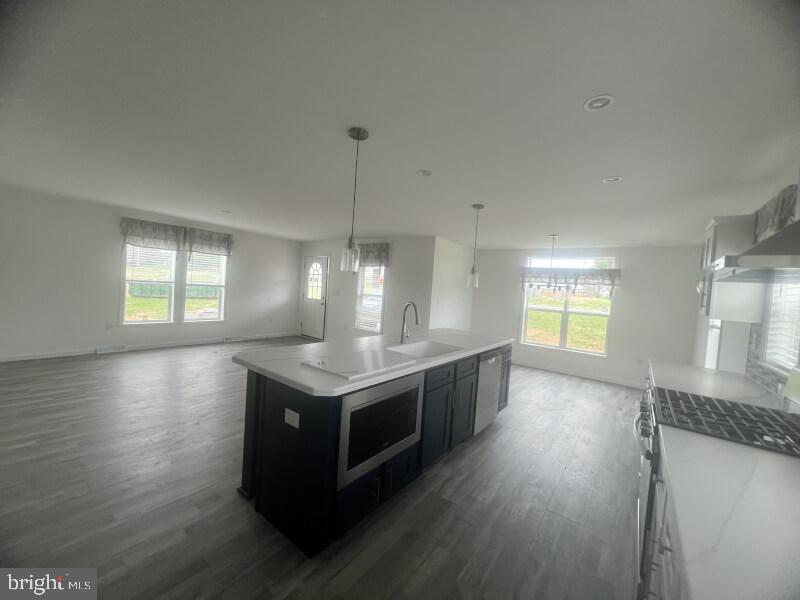 71 Ash Road Hamburg, PA 19526 - Photo 8 of 21 a kitchen with stainless steel appliances granite countertop a sink a stove and wooden floor