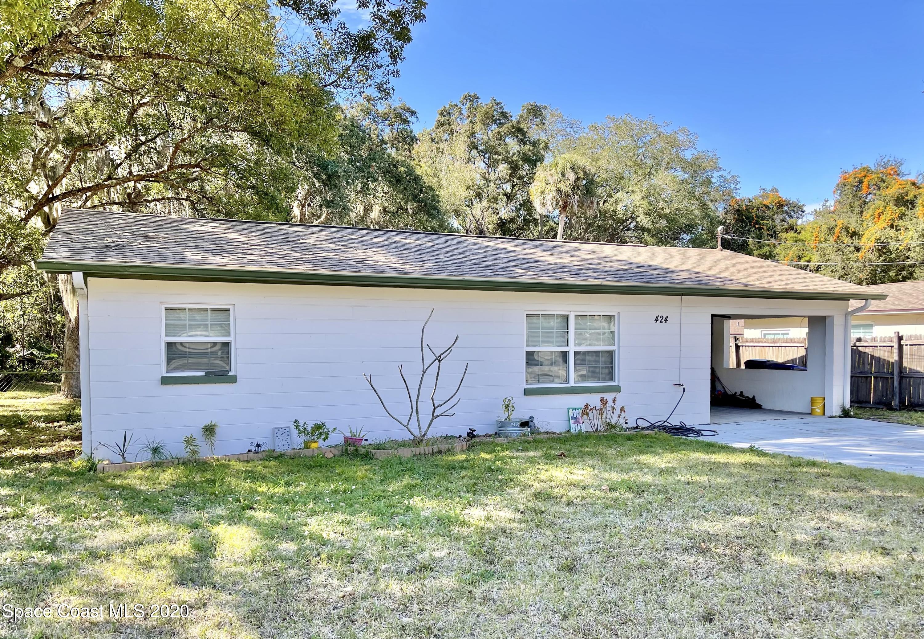 424 Rock Pit Road Titusville, FL 32796 - Photo 1 of 19 Front of Home