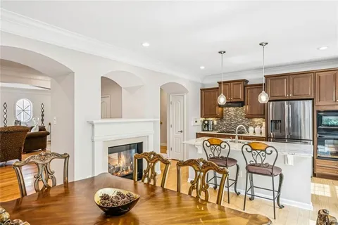 a kitchen with stainless steel appliances granite countertop a stove and a sink