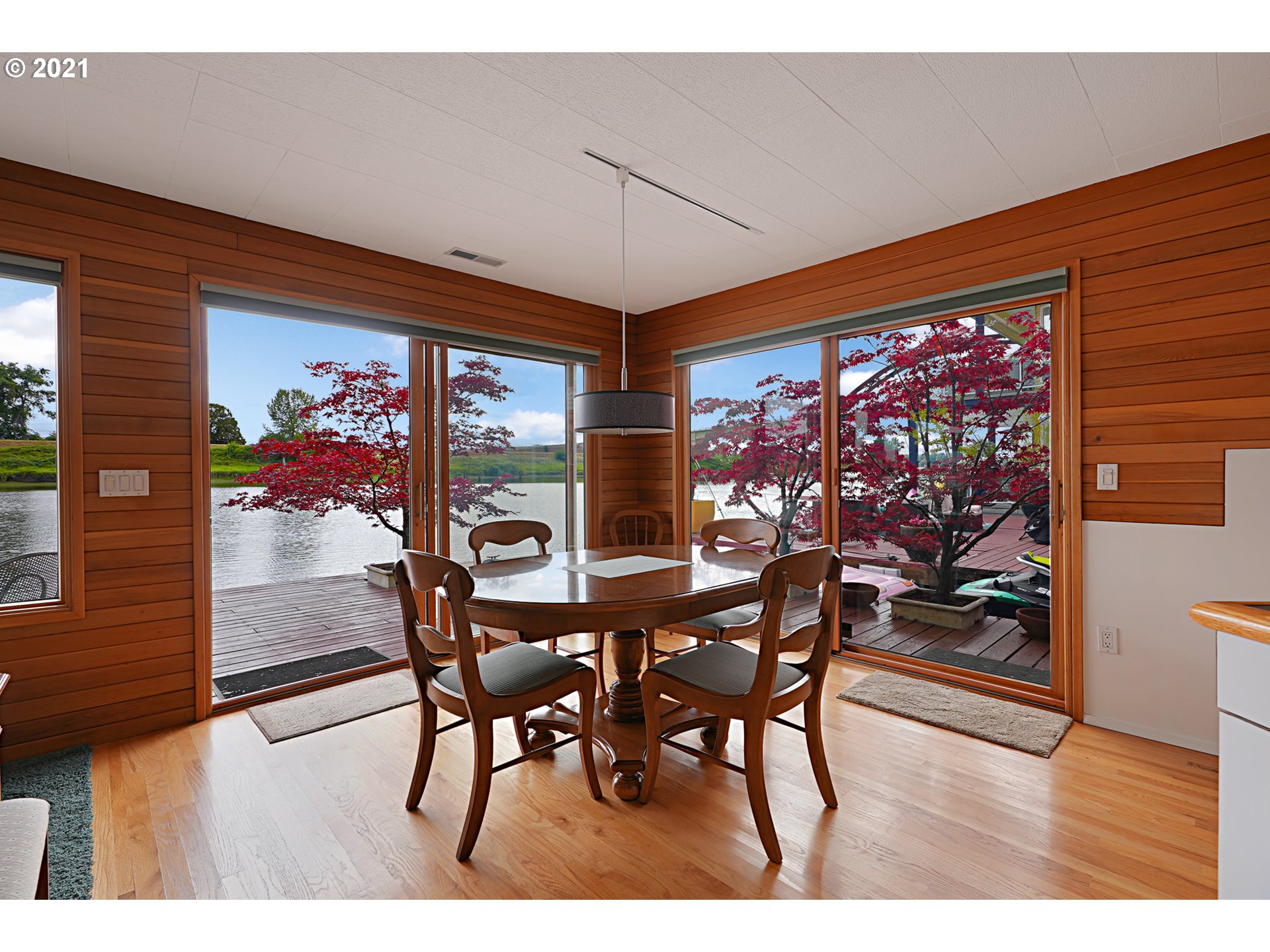 14583 Northwest Larson Road, Unit 6 Portland, OR 97231 - Photo 3 of 32 a view of a dining room with furniture and wooden floor